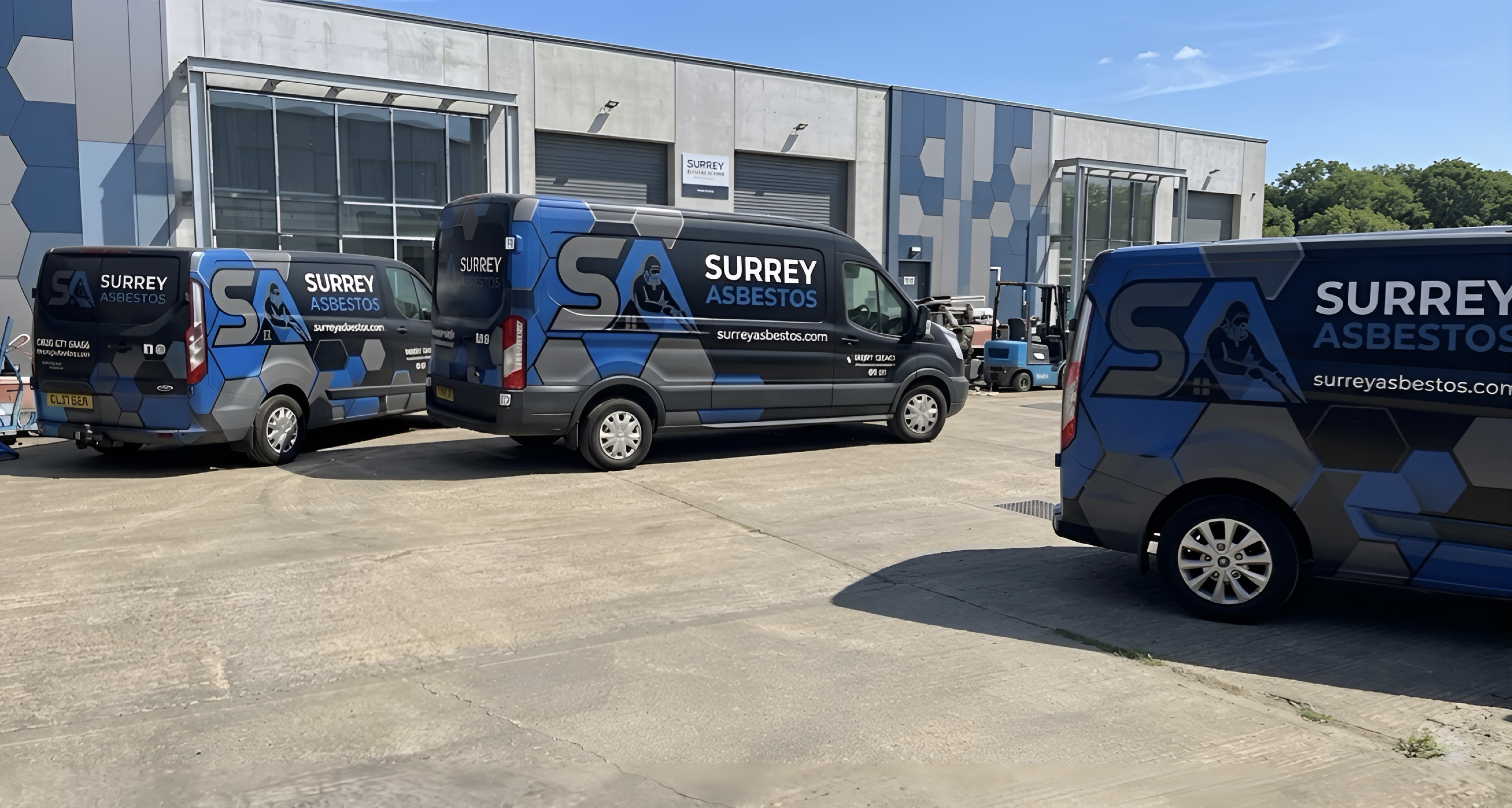 HSE licensed asbestos removal operatives in full PPE working inside a sealed enclosure — Surrey Asbestos