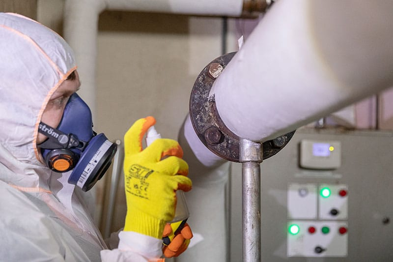 HSE licensed asbestos removal operatives in PPE at work in Surrey
